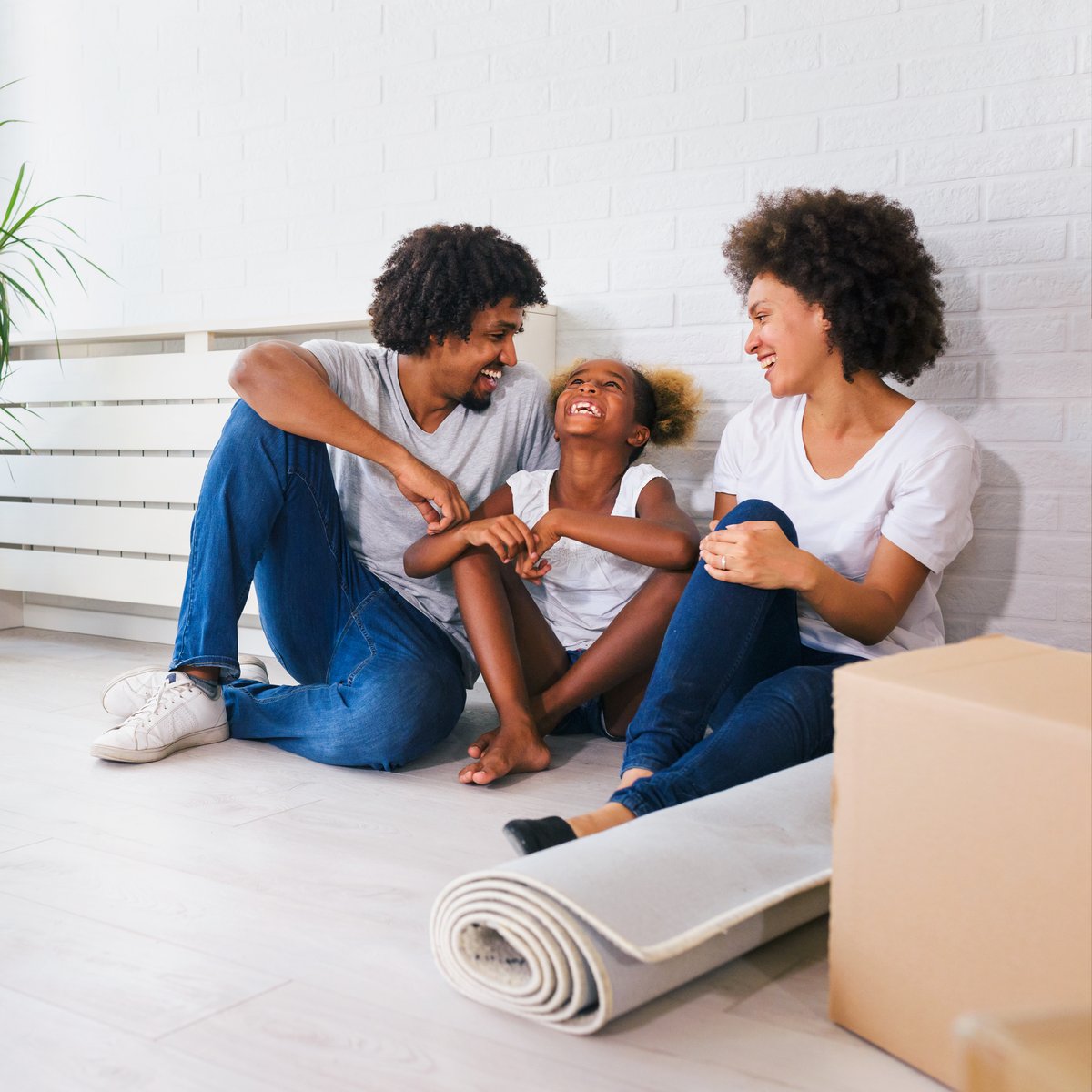 Happy family settling into their new home after moving