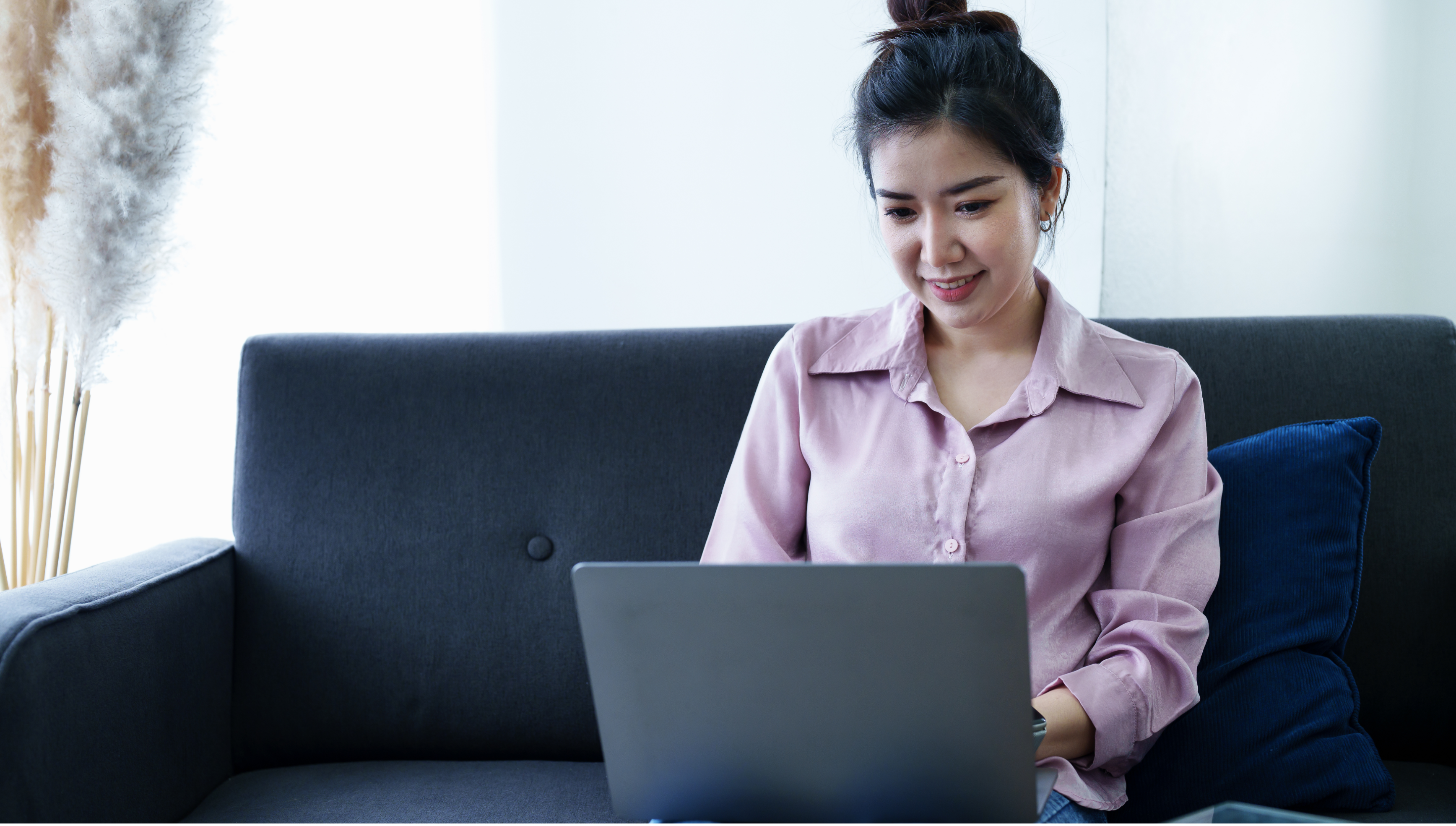 Self-employed woman working on a laptop at home